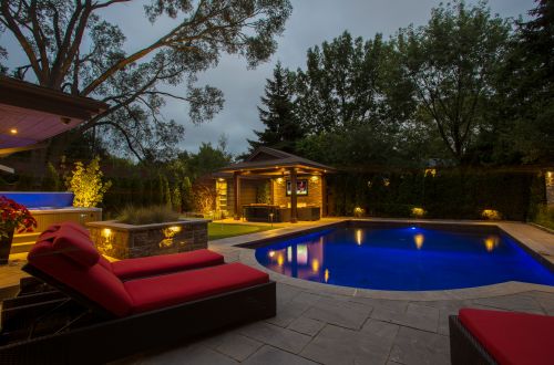Chaise and pool at night
